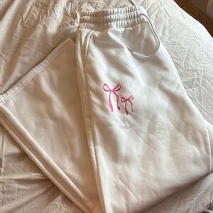 White Sweatpants with Pink Bow Design